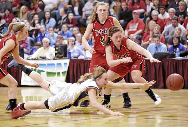 Washburn's Rebecca Campbell, bottom, dives for a loose ball with Fort Fairfield's Danielle Tracy (25, right), Amanda Hotham and other Tigers nearby in the first quarter of their Class D East girls semifinal at Bangor Auditorium Thursday afternoon. Washburn's Rebecca Campbell, bottom, dives for a loose ball with Fort Fairfield's Danielle Tracy (25, right), Amanda Hotham and other Tigers nearby in the first quarter of their Class D East girls semifinal at Bangor Auditorium Thursday afternoon.
