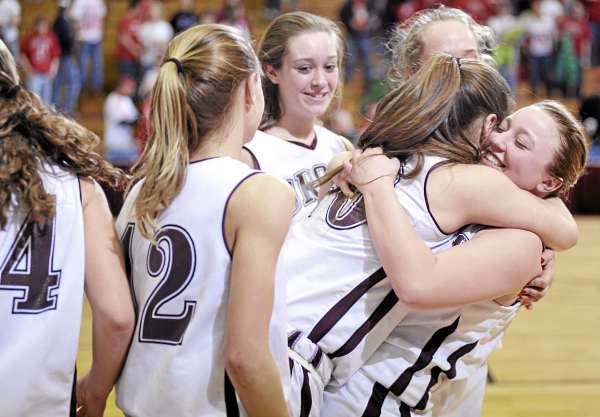 Jade Keezer, far right gives Orono teammate Caleigh Paul a big hug as they celebrate with teammates following their Class C East girls semifinal victory over Dexter at Bangor Auditorium Friday afternoon, Feb. 25, 2011. Jade Keezer, far right gives Orono teammate Caleigh Paul a big hug as they celebrate with teammates following their Class C East girls semifinal victory over Dexter at Bangor Auditorium Friday afternoon, Feb. 25, 2011.