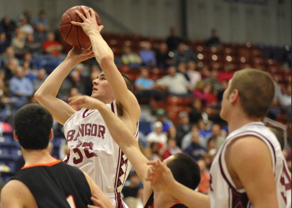 Bangor's Zach Blodgett puts up a shot during the first quarter of the Rams' Eastern Maine Class A boys quarterfinal game against the Brunswick Dragons at the Augusta Civic Center Saturday night. Bangor won 67-38. Bangor's Zach Blodgett puts up a shot during the first quarter of the Rams' Eastern Maine Class A boys quarterfinal game against the Brunswick Dragons at the Augusta Civic Center Saturday night. Bangor won 67-38.