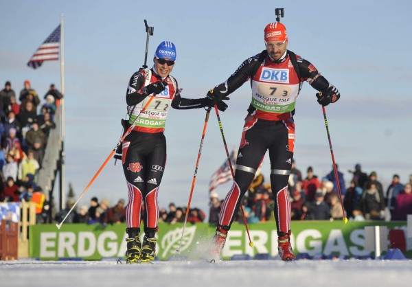 Magdalena Neuner (second leg), left, taps German teammate Alexander Wolf (third leg) in the I.B.U. World Cup mixed relay biathlon competition at the Nordic Heritage Center in Presque Isle, Maine on Saturday, Feb. 5, 2011. The German team took first place in the competition Saturday. Magdalena Neuner (second leg), left, taps German teammate Alexander Wolf (third leg) in the I.B.U. World Cup mixed relay biathlon competition at the Nordic Heritage Center in Presque Isle, Maine on Saturday, Feb. 5, 2011. The German team took first place in the competition Saturday.