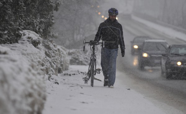 As the snow started to accumulate late Friday morning, Philip Andresen of Rockland, a third-year physics major at the University of Maine in Orono, walked his bike back to his apartment in Old Town. "I biked to school this morning and halfway back, I started slipping so I decided to hoof it," he said. As the snow started to accumulate late Friday morning, Philip Andresen of Rockland, a third-year physics major at the University of Maine in Orono, walked his bike back to his apartment in Old Town. "I biked to school this morning and halfway back, I started slipping so I decided to hoof it," he said.