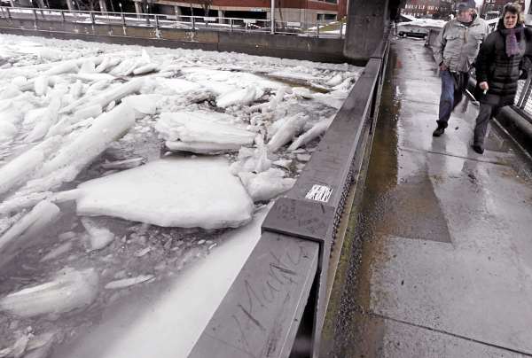 Crossing a footbridge over the Kenduskeag Stream with friend Kerry Pratt (right) of Orono, George Zapadick of Bangor surveys the massive ice sheets in the stream just after Bangor's predicted high tide at 2:46 p.m. Friday. The city blocked parking areas and posted signs near the Kenduskeag Stream Friday as a flood watch was in effect in the afternoon and early evening. Crossing a footbridge over the Kenduskeag Stream with friend Kerry Pratt (right) of Orono, George Zapadick of Bangor surveys the massive ice sheets in the stream just after Bangor's predicted high tide at 2:46 p.m. Friday. The city blocked parking areas and posted signs near the Kenduskeag Stream Friday as a flood watch was in effect in the afternoon and early evening.