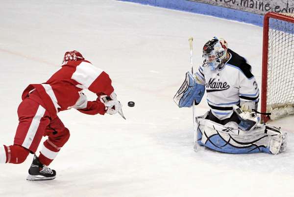 BDN File Photo
Boston University's Cory Trivino shoots the puck by Maine goalie Shawn Sirman during a BU win over Maine in January. Maine, which wound up 17-12-7, finished 57th out of 58 Division I schools in save percentage at .884.
BDN File Photo
Boston University's Cory Trivino shoots the puck by Maine goalie Shawn Sirman during a BU win over Maine in January. Maine, which wound up 17-12-7, finished 57th out of 58 Division I schools in save percentage at .884.