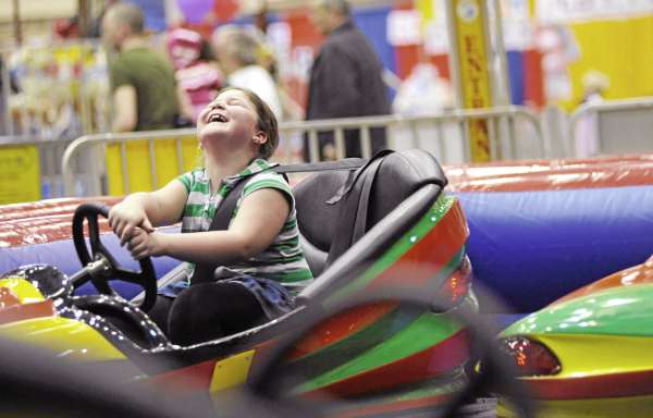 Mabel Eames,7, of Bangor was all giggles as dad Bruce Raymond (not pictured) of Bangor collides with her bumper car-- one of the many amusements at the Bangor YMCA Spring Fair at the Bangor Auditorium Friday. Mabel Eames,7, of Bangor was all giggles as dad Bruce Raymond (not pictured) of Bangor collides with her bumper car-- one of the many amusements at the Bangor YMCA Spring Fair at the Bangor Auditorium Friday.