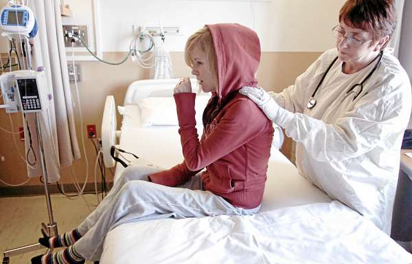 Physical therapist Susan Butler McNamara, right, encourages Ashley Drew to cough while working with her to loosen mucous in her lungs Friday, April 2, 2010 at Maine Medical Center in Portland where Drew was hospitalized with a lung infection brought on by her cystic fibrosis. A healthy pair of lungs function at 98 percent capacity, Ashley said. Her lungs are at 26 percent capacity and she's hoping to get on a lung transplant list soon. Physical therapist Susan Butler McNamara, right, encourages Ashley Drew to cough while working with her to loosen mucous in her lungs Friday, April 2, 2010 at Maine Medical Center in Portland where Drew was hospitalized with a lung infection brought on by her cystic fibrosis. A healthy pair of lungs function at 98 percent capacity, Ashley said. Her lungs are at 26 percent capacity and she's hoping to get on a lung transplant list soon.