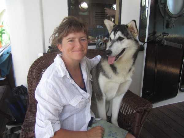 Captain Karen Miles and "Pitsik" the Husky pup, a gift from Inuit friends Captain Karen Miles and "Pitsik" the Husky pup, a gift from Inuit friends