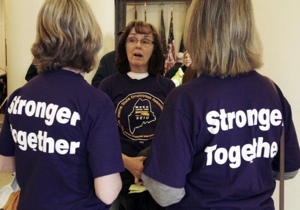 Dorothy Eaton (center) of Augusta talks with Cathy Green (left) of Winslow and Betty Wilkins (right) of Hallowell, all state workers, during a rally at the State House in Augusta, Maine, on Wednesday, March 2, 2011. Union members upset with the governor's proposals to change the pension system gathered at the State House. Dorothy Eaton (center) of Augusta talks with Cathy Green (left) of Winslow and Betty Wilkins (right) of Hallowell, all state workers, during a rally at the State House in Augusta, Maine, on Wednesday, March 2, 2011. Union members upset with the governor's proposals to change the pension system gathered at the State House.