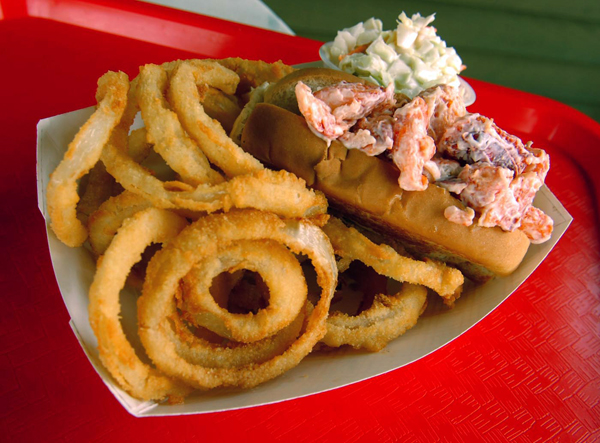A lobster roll basket with onion rings and coleslaw from Dana's Grill at Dockside in Hampden. A lobster roll basket with onion rings and coleslaw from Dana's Grill at Dockside in Hampden.