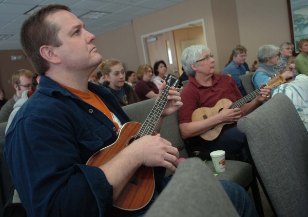 Chris Healy (left) of Hampden and Jo Bennett (right) of Newport listen to some tips for ukulele playing on Saturday at the Newport Cultural Center in Newport. "It sounds wonderful," Bennett said of the ukulele, which she first tried her hand at as a child. Chris Healy (left) of Hampden and Jo Bennett (right) of Newport listen to some tips for ukulele playing on Saturday at the Newport Cultural Center in Newport. "It sounds wonderful," Bennett said of the ukulele, which she first tried her hand at as a child.