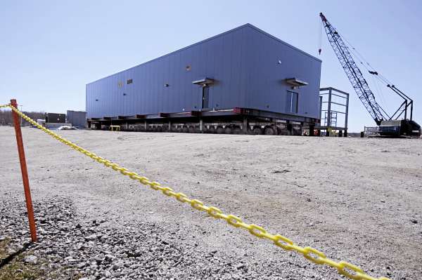 Resting on a many-wheeled Mammoet transport configuration, the first of 22 electric room modules under construction at Cianbro's Eastern Manufacturing Facility in Brewer awaits shipment to refinery in Newfoundland. Resting on a many-wheeled Mammoet transport configuration, the first of 22 electric room modules under construction at Cianbro's Eastern Manufacturing Facility in Brewer awaits shipment to refinery in Newfoundland.