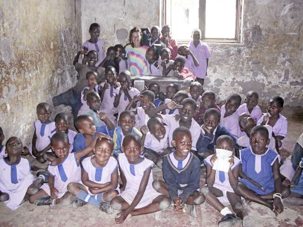 Dee Wilbur (rear) poses with school children in Uganda in 2009. Wilbur and Ben Brennan are organizing The Race for Human Race 5K road race set for May 1 at the University of Maine. Dee Wilbur (rear) poses with school children in Uganda in 2009. Wilbur and Ben Brennan are organizing The Race for Human Race 5K road race set for May 1 at the University of Maine.