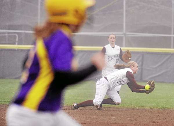 Bucksport High School's Jen Wight (left) runs to first base as Ellsworth High School's Sam McGuire dives but can't catch the ball during the third inning in Bucksport Thursday afternoon. The game ended after the top of the fifth inning with Bucksport winning 12-0. Bucksport High School's Jen Wight (left) runs to first base as Ellsworth High School's Sam McGuire dives but can't catch the ball during the third inning in Bucksport Thursday afternoon. The game ended after the top of the fifth inning with Bucksport winning 12-0.