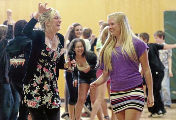 Agnete Kjerstad (left) and Elise Toft (right), lead students in a traditional Norwegian dance during International Day at Wagner Middle School in Winterport on Friday, April 29, 2011. Kjerstad and Toft, who both hail from Norway, were among the 20 exchange students representing 16 countries who performed entertaining educational presentations about their home countries during the event. The exchange students arrived last August and have been attending school at numerous regional high schools, including Bangor High School, Hampden Academy, Orono High School, Brewer High School, John Bapst Memorial High School, and Caribou High School. Agnete Kjerstad (left) and Elise Toft (right), lead students in a traditional Norwegian dance during International Day at Wagner Middle School in Winterport on Friday, April 29, 2011. Kjerstad and Toft, who both hail from Norway, were among the 20 exchange students representing 16 countries who performed entertaining educational presentations about their home countries during the event. The exchange students arrived last August and have been attending school at numerous regional high schools, including Bangor High School, Hampden Academy, Orono High School, Brewer High School, John Bapst Memorial High School, and Caribou High School.