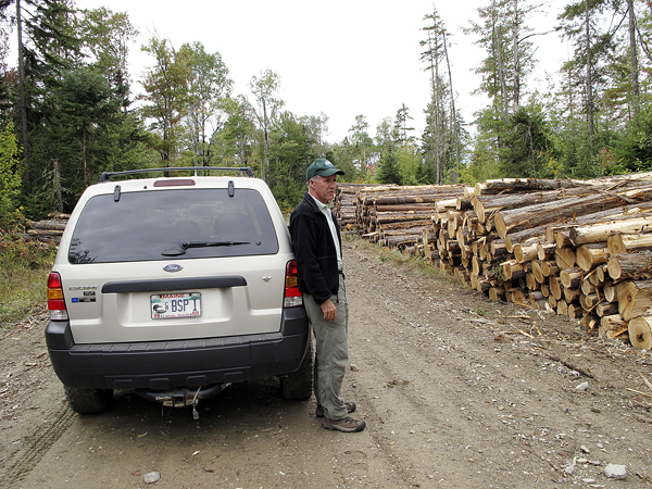 Jensen Bissell, director of Baxter State Park, surveys the stacks of logs from a recent timber harvesting operation in the park's Scientific Forest Management Area in 2009. Comprising roughly 29,000 acres in the park's northwest corner, the SFMA is the only location in Baxter where logging occurs. Former Gov. Percival Baxter set up the SFMA as a place where cutting-edge forestry and research could be carried out. Jensen Bissell, director of Baxter State Park, surveys the stacks of logs from a recent timber harvesting operation in the park's Scientific Forest Management Area in 2009. Comprising roughly 29,000 acres in the park's northwest corner, the SFMA is the only location in Baxter where logging occurs. Former Gov. Percival Baxter set up the SFMA as a place where cutting-edge forestry and research could be carried out.
