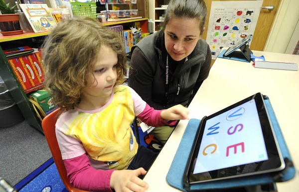 Rhianah Landry, 5, a kindergarten student at Washburn Elementary School in Auburn works with literacy instructor Mauri Dufour using letter identification program on an iPad tablet on Thursday, April 7, 2011. Rhianah Landry, 5, a kindergarten student at Washburn Elementary School in Auburn works with literacy instructor Mauri Dufour using letter identification program on an iPad tablet on Thursday, April 7, 2011.