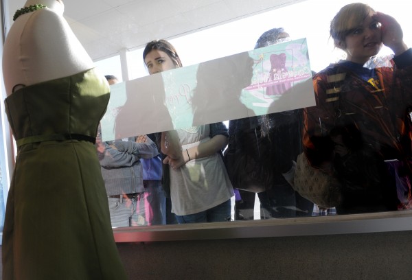 Kourtney Clendenning (left), 16, and Shawna Dakin (right), 16, of Searsport peered through the window to get a sneak peak before the doors opened at 8 a.m. for the 6th annual Cinderella Project of Maine prom dress giveaway at Reny's Plaza in Belfast Saturday morning, April 9, 2011. Kourtney Clendenning (left), 16, and Shawna Dakin (right), 16, of Searsport peered through the window to get a sneak peak before the doors opened at 8 a.m. for the 6th annual Cinderella Project of Maine prom dress giveaway at Reny's Plaza in Belfast Saturday morning, April 9, 2011.