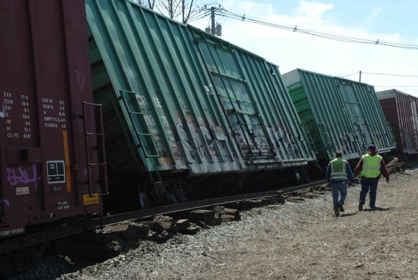 Emergency workers survey the Pan-Am train derailment which occurred parallel to Rt. 2 on Old Town's French Island. According to Old Town Fire Chief Steve O'Malley, the thirty car train derailed in two places in the late morning of Tuesday, April 12, 2011. No injuries weer reported, but access to French Island neighborhoods was limited. Emergency workers survey the Pan-Am train derailment which occurred parallel to Rt. 2 on Old Town's French Island. According to Old Town Fire Chief Steve O'Malley, the thirty car train derailed in two places in the late morning of Tuesday, April 12, 2011. No injuries weer reported, but access to French Island neighborhoods was limited.