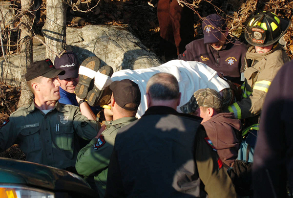 Rescue crews carry down a man from Mt. Megunticook on Thursday, April 7, 2011. Police identified the man as Charles “Reed” Black, 68, of Camden. Earlier in the day, an injured woman, Black's wife, Lisa, 52, made her way down the mountain, which lead law enforcement authorities to search for her husband. Officials have not immediately disclosed if a crime occurred. Rescue crews carry down a man from Mt. Megunticook on Thursday, April 7, 2011. Police identified the man as Charles “Reed” Black, 68, of Camden. Earlier in the day, an injured woman, Black's wife, Lisa, 52, made her way down the mountain, which lead law enforcement authorities to search for her husband. Officials have not immediately disclosed if a crime occurred.