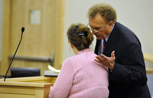 Cindy Dunton, Newburgh's former deputy town clerk, consults her attorney, Dale Thistle, right, while making her guilty plea before Superior Court Justice William R. Anderson at Penobscot Judicial Center Monday afternoon. Dunton pleaded guilty to Class B theft by unauthorized taking. She waived her right to a trial and the next step is sentencing. Cindy Dunton, Newburgh's former deputy town clerk, consults her attorney, Dale Thistle, right, while making her guilty plea before Superior Court Justice William R. Anderson at Penobscot Judicial Center Monday afternoon. Dunton pleaded guilty to Class B theft by unauthorized taking. She waived her right to a trial and the next step is sentencing.