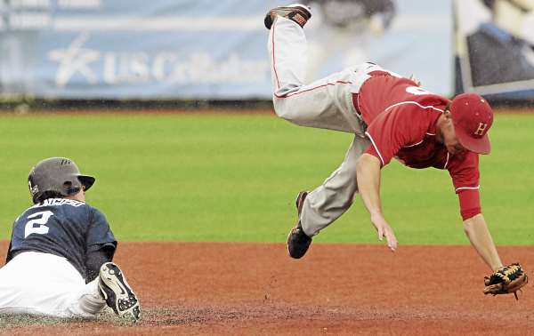 Hartford's Simon Kudernatsch trips while attempting to field a throw as UMaine's Michael Fransoso steals second base in seventh-inning action at Mahaney Diamond in Orono Sunday. Maine won 3-2 in 10 innings. Hartford's Simon Kudernatsch trips while attempting to field a throw as UMaine's Michael Fransoso steals second base in seventh-inning action at Mahaney Diamond in Orono Sunday. Maine won 3-2 in 10 innings.