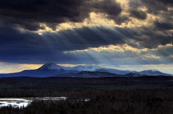 In this March 19, 2010 photo, sun rays filter through clouds over 5,267-foot Mount Katahdin in Maine's Baxter State Park. Last year, starting in March, more than 1400 hikers set off from Georgia's Springer Mountain with the goal of reaching the summit of Mount Katahdin, the northern terminus of the 2,100-mile Appalachian Trail. About 350 hikers completed the northbound hike, according the the Appalachian Trail Conservancy. (AP Photo/Robert F. Bukaty) In this March 19, 2010 photo, sun rays filter through clouds over 5,267-foot Mount Katahdin in Maine's Baxter State Park. Last year, starting in March, more than 1400 hikers set off from Georgia's Springer Mountain with the goal of reaching the summit of Mount Katahdin, the northern terminus of the 2,100-mile Appalachian Trail. About 350 hikers completed the northbound hike, according the the Appalachian Trail Conservancy. (AP Photo/Robert F. Bukaty)