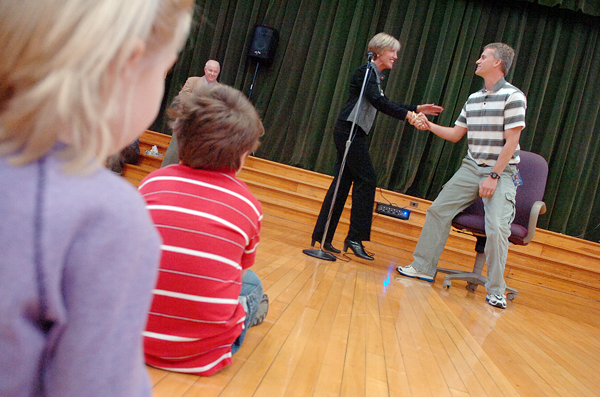 Bangor Schools Superintendent Betsy Webb congratulates Vine Street School physical education teacher Jason Pangburn after he was told he was a state teacher of the year award recipient during a surprise assembly at Vine Street School on Thrusday morning. In the background is Vine Street Principal Tim McCluskey. Bangor Schools Superintendent Betsy Webb congratulates Vine Street School physical education teacher Jason Pangburn after he was told he was a state teacher of the year award recipient during a surprise assembly at Vine Street School on Thrusday morning. In the background is Vine Street Principal Tim McCluskey.