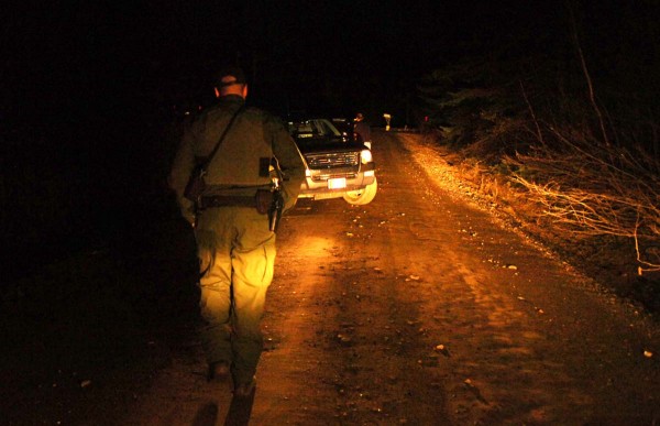 Law enforcement officers guard the road leading to a home in Dover-Foxcroft where a person was shot and killed, reportedly by another family member, in the early evening hours of Sunday, May 1, 2011. Law enforcement officers guard the road leading to a home in Dover-Foxcroft where a person was shot and killed, reportedly by another family member, in the early evening hours of Sunday, May 1, 2011.