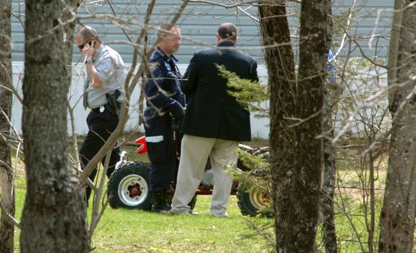 Returning to the scene of a Sunday shooting that left one man dead, Maine State Police detectives confer as they consider evidence around a red ATV on the lawn of 155 French Road in Dover-Foxcroft early Monday afternoon, May 2, 2011. A half dozen investigators were on scene taking photographs, surveying the site and collecting evidence. Returning to the scene of a Sunday shooting that left one man dead, Maine State Police detectives confer as they consider evidence around a red ATV on the lawn of 155 French Road in Dover-Foxcroft early Monday afternoon, May 2, 2011. A half dozen investigators were on scene taking photographs, surveying the site and collecting evidence.