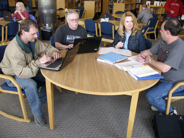 At the start of 2009, 200 employees of Fraser Timber Inc. lost their jobs after the business shuttered its sawmills in Ashland and Masardis for an indefinite period of time. The news came just after Northern Maine Community College reconvened for its spring semester, but college officials wanted to do something to help the displaced workers. They created an entire special semester of course offerings tailored to laid-off workers. On Saturday, 18 of the displaced workers, including (from left,) Albert Nadeau of Presque Isle, Pierre Gagne of Portage Lake, Tanya Clark of Ashland and Richard Michaud of Houlton will graduate from the college. The four are pictured studying for final exams in the NMCC library last week. At the start of 2009, 200 employees of Fraser Timber Inc. lost their jobs after the business shuttered its sawmills in Ashland and Masardis for an indefinite period of time. The news came just after Northern Maine Community College reconvened for its spring semester, but college officials wanted to do something to help the displaced workers. They created an entire special semester of course offerings tailored to laid-off workers. On Saturday, 18 of the displaced workers, including (from left,) Albert Nadeau of Presque Isle, Pierre Gagne of Portage Lake, Tanya Clark of Ashland and Richard Michaud of Houlton will graduate from the college. The four are pictured studying for final exams in the NMCC library last week.