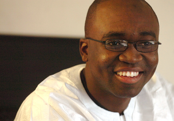 Mama Sora, pictured in his Bangor home on Tuesday, will be receiving his MBA degree from Husson University on Saturday. Sora, who is a native of Mali, arrived in Maine without knowing English, but has since earned both undergraduate and graduate degrees, married his Maine-born wife Tina, became a father, and also became an American citizen. Mama Sora, pictured in his Bangor home on Tuesday, will be receiving his MBA degree from Husson University on Saturday. Sora, who is a native of Mali, arrived in Maine without knowing English, but has since earned both undergraduate and graduate degrees, married his Maine-born wife Tina, became a father, and also became an American citizen.