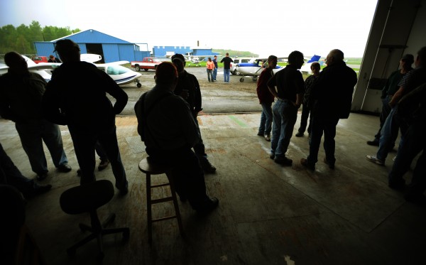 Airplane enthusiast sit in a hangar and talk aviation as rain falls at the Old Town Municipal Airport on Saturday, May 21, 2011 during International Learn to Fly Day sponsored by the Penobscot Valley Chapter 827 of the Experimental Aircraft Association. Airplane enthusiast sit in a hangar and talk aviation as rain falls at the Old Town Municipal Airport on Saturday, May 21, 2011 during International Learn to Fly Day sponsored by the Penobscot Valley Chapter 827 of the Experimental Aircraft Association.