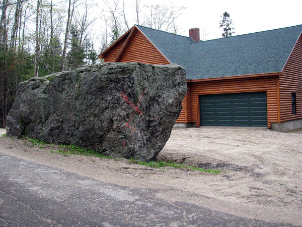 Getting this 12- by 17-foot glacial erratic, a rock deposited by a glacier, removed from in front of their new garage at 409 Howard Pond Road in Hanover has been difficult for Glen and Suzanne LaForest. Last year, selectmen voted 2-1 not to remove the boulder. Getting this 12- by 17-foot glacial erratic, a rock deposited by a glacier, removed from in front of their new garage at 409 Howard Pond Road in Hanover has been difficult for Glen and Suzanne LaForest. Last year, selectmen voted 2-1 not to remove the boulder.
