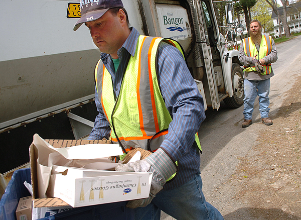 Bangor Public Works Department employees Jerry Maynard, foreground, and Rick LeGasse, background, pick up recyclable materials as part of the city's curbside recycling program on Monday. Despite opposition from some residents, the Bangor City Council is exploring the possibility of implementing single-stream recycling and pay-as-you-go trash removal. Bangor Public Works Department employees Jerry Maynard, foreground, and Rick LeGasse, background, pick up recyclable materials as part of the city's curbside recycling program on Monday. Despite opposition from some residents, the Bangor City Council is exploring the possibility of implementing single-stream recycling and pay-as-you-go trash removal.