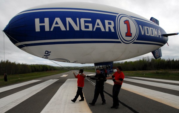 An airship crew from Lightship Group Inc. of Orlando, Fla., wrestles a Hangar 1 Vodka blimp onto the ground at Lincoln Regional Airport on Wednesday, May 18, 2011. The airship made an unplanned stop in Lincoln when one of its ground crew pickup trucks needed repair and low, overcast skies south of Bangor made the stop advisable, officials said. An airship crew from Lightship Group Inc. of Orlando, Fla., wrestles a Hangar 1 Vodka blimp onto the ground at Lincoln Regional Airport on Wednesday, May 18, 2011. The airship made an unplanned stop in Lincoln when one of its ground crew pickup trucks needed repair and low, overcast skies south of Bangor made the stop advisable, officials said.