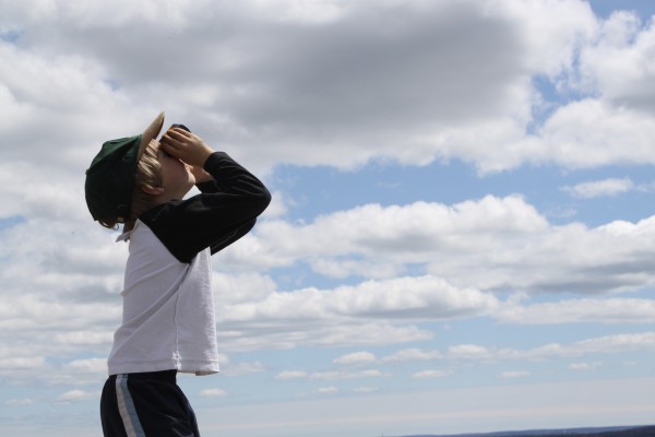 Zephyr Caputo, 5, searches the skies over Freeport for hawks on the summit of Bradbury Mountain on Saturday, April 30, during the first "Feathers Over Freeport" weekend-long bird-watching festival. Zephyr Caputo, 5, searches the skies over Freeport for hawks on the summit of Bradbury Mountain on Saturday, April 30, during the first "Feathers Over Freeport" weekend-long bird-watching festival.
