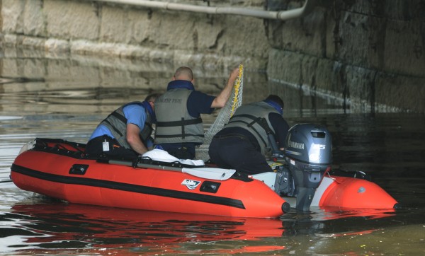 Bangor Fire personnel investigate the report of a body floating in the Kenduskeag Stream in downtown Bangor on Monday, May 30, 2011. Bangor Fire personnel investigate the report of a body floating in the Kenduskeag Stream in downtown Bangor on Monday, May 30, 2011.