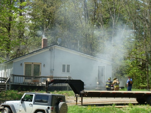 A home owned by Andy Cookson on the McPhetres Road in Sangerville was damaged Wednesday by smoke and water after a fire broke out in the cellar of the home where Cookson was soldering a pipe. A hot spark ignited a woodpile in the cellar. A home owned by Andy Cookson on the McPhetres Road in Sangerville was damaged Wednesday by smoke and water after a fire broke out in the cellar of the home where Cookson was soldering a pipe. A hot spark ignited a woodpile in the cellar.