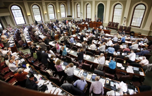 In this June 9, 2011 photo, legislators stand and applaud in the House chamber at the State House in Augusta. The state's first Republican-led Legislature in decades did as it promised as it rolled back business regulations, and after years of trying, made major changes in the health insurance laws during the six-month 2011 session. In this June 9, 2011 photo, legislators stand and applaud in the House chamber at the State House in Augusta. The state's first Republican-led Legislature in decades did as it promised as it rolled back business regulations, and after years of trying, made major changes in the health insurance laws during the six-month 2011 session.