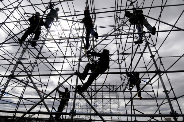 Workers with Old Town-based Production Services of Maine start setting up the scaffolding in April for this season's Waterfront Concert Series in Bangor. City councilors believe they have come up with a solution to balance the benefits of the Waterfront Concerts with future economic development on the waterfront while still heeding the concerns of some West Side residents. Councilors favor a reconfiguration that would move the stage away from Railroad Street toward Hollywood Slots and rotate the structure to face the opposite direction. Workers with Old Town-based Production Services of Maine start setting up the scaffolding in April for this season's Waterfront Concert Series in Bangor. City councilors believe they have come up with a solution to balance the benefits of the Waterfront Concerts with future economic development on the waterfront while still heeding the concerns of some West Side residents. Councilors favor a reconfiguration that would move the stage away from Railroad Street toward Hollywood Slots and rotate the structure to face the opposite direction.