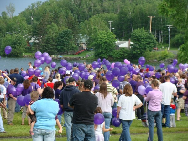 More than hundred people attended a gathering Saturday at the Lake Wassookeag public beach for domestic violence awareness. Purple balloons were launched by the attendees in remembrance of Amy, Coty and Monica Lake who were murdered by Amy's husband Steven Lake, the father of their children. More than hundred people attended a gathering Saturday at the Lake Wassookeag public beach for domestic violence awareness. Purple balloons were launched by the attendees in remembrance of Amy, Coty and Monica Lake who were murdered by Amy's husband Steven Lake, the father of their children.