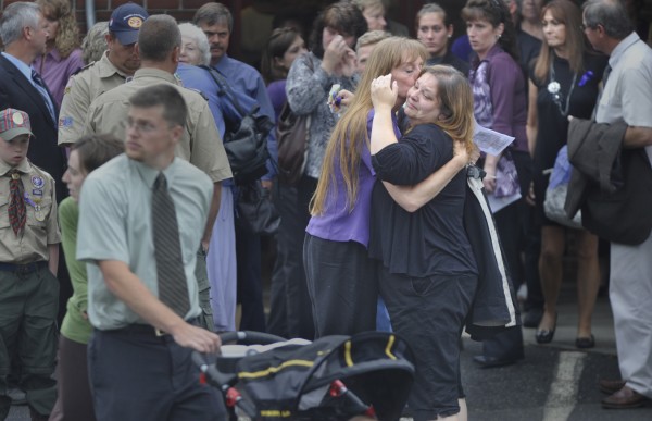Friends and family gather outside Dexter Regional High School following Saturday morning's funerals for Amy Lake and her two children Monica, 12, and Coty, 13. Several hundred mourners attended the funeral in an outpouring of support for the family as well as to heighten awareness about domestic violence. Friends and family gather outside Dexter Regional High School following Saturday morning's funerals for Amy Lake and her two children Monica, 12, and Coty, 13. Several hundred mourners attended the funeral in an outpouring of support for the family as well as to heighten awareness about domestic violence.