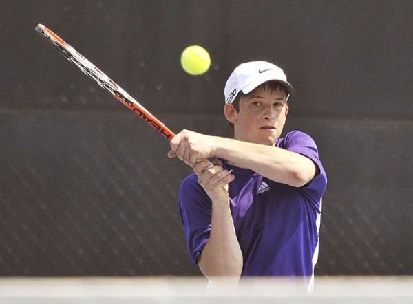 Phillip Schoenberger of Hampden hits a two-handed shot in competition at Colby College in Waterville Wednesday. Schoenberger defeated Lewiston's Eric Hall in a three-set match, but the Blue Devils won the Eastern Maine Class A final team match 4-1. Phillip Schoenberger of Hampden hits a two-handed shot in competition at Colby College in Waterville Wednesday. Schoenberger defeated Lewiston's Eric Hall in a three-set match, but the Blue Devils won the Eastern Maine Class A final team match 4-1.