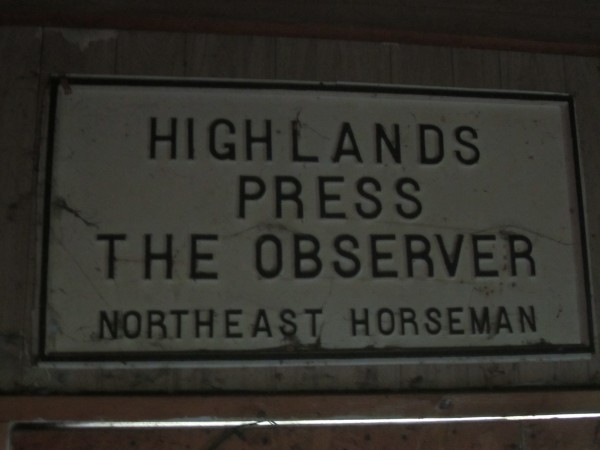 An old sign in the rafters for the Highlands Press Print Shop. An old sign in the rafters for the Highlands Press Print Shop.
