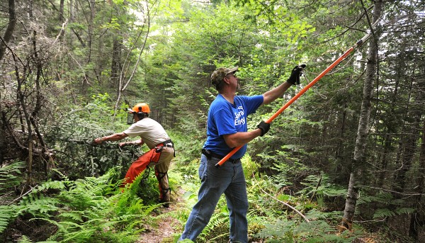 John Bajkowski of Spectra Energy (right) and Roger Chandler of the Inland fisheries and Wildlife work on clearing a trail at the Sunkhaze Meadows National Wildlife Refuge in Milford Wednesday afternoon, June 29, 2011. They were among the 14 volunteers who worked on the trails to get some much needed clearing done. John Bajkowski of Spectra Energy (right) and Roger Chandler of the Inland fisheries and Wildlife work on clearing a trail at the Sunkhaze Meadows National Wildlife Refuge in Milford Wednesday afternoon, June 29, 2011. They were among the 14 volunteers who worked on the trails to get some much needed clearing done.
