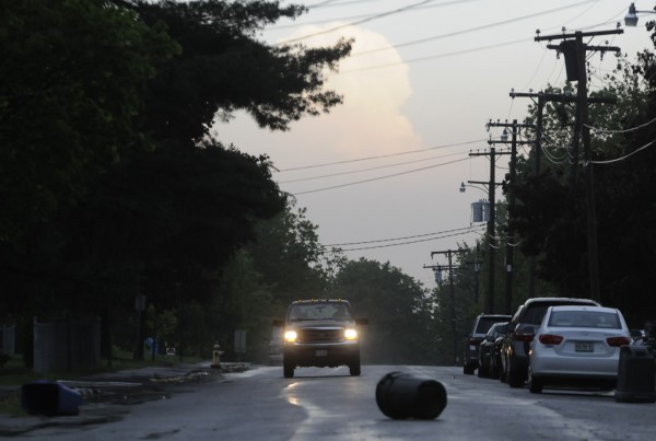 A pickup truck gets ready to dodge a trash can blown onto Thirteenth Street during Wednesday morning's thunderstorm. A pickup truck gets ready to dodge a trash can blown onto Thirteenth Street during Wednesday morning's thunderstorm.