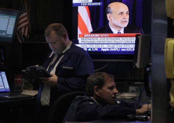 Federal Reserve Chairman Ben Bernanke's news conference is seen on a television screen in a booth on the floor of the New York Stock Exchange Wednesday, June 22, 2011. Bernanke said some of the problems that are slowing the U.S. economy could persist into next year. Federal Reserve Chairman Ben Bernanke's news conference is seen on a television screen in a booth on the floor of the New York Stock Exchange Wednesday, June 22, 2011. Bernanke said some of the problems that are slowing the U.S. economy could persist into next year.