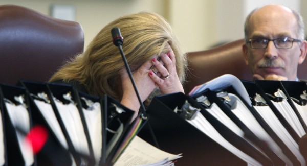 Assistant Majority Leader Debra Plowman, R-Hampden, puts her face in her hands during a long debate on the budget in the Senate at the State House in Augusta on Thursday, June 16, 2011. After many long days and nights of negotiations, the Senate gave their final approval to a $6.1 billion general fund budget. At right is Sen. Richard Rosen, R-Bucksport. Assistant Majority Leader Debra Plowman, R-Hampden, puts her face in her hands during a long debate on the budget in the Senate at the State House in Augusta on Thursday, June 16, 2011. After many long days and nights of negotiations, the Senate gave their final approval to a $6.1 billion general fund budget. At right is Sen. Richard Rosen, R-Bucksport.