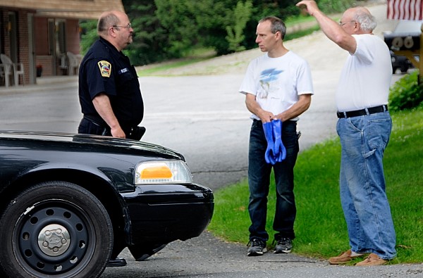 Brewer police Officer Peter Rancourt thanks a local business owner (center) and his father on North Main Street in Brewer after the businessman called in a tip Wednesday morning that led to the arrest of Bangor murder suspect William Hall. Hall had escaped from Dorothea Dix Psychiatric Center in Bangor on Tuesday evening, putting in motion an overnight manhunt. Brewer police Officer Peter Rancourt thanks a local business owner (center) and his father on North Main Street in Brewer after the businessman called in a tip Wednesday morning that led to the arrest of Bangor murder suspect William Hall. Hall had escaped from Dorothea Dix Psychiatric Center in Bangor on Tuesday evening, putting in motion an overnight manhunt.