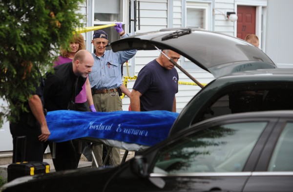 Bangor police and Maine state medical examiner's office personnel remove the body of a man from Apartment 24 at the Ledgewood 1 apartment complex on Ohio Street in Bangor on June 13. Bangor police and Maine state medical examiner's office personnel remove the body of a man from Apartment 24 at the Ledgewood 1 apartment complex on Ohio Street in Bangor on June 13.