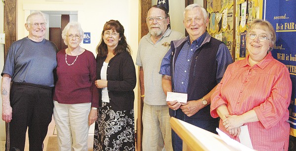 The Belfast Rotary Club recently made its annual donations to area food cupboards and the Belfast Soup Kitchen from the proceeds of its pancake breakfasts. Club member Marjorie Crowley (third from left) gave out the donations to (from left) Cleo and Donna Alley of Northport Food Cupboard, Alex Allmayer-Beck of the Belfast Soup Kitchen, Ralph Harvey of the Searsport Methodist Church Food Cupboard and June Clark of the Greater Bay Area Ministerium Food Cupboard. The Rev. Scott Baker of the Little River Baptist Church was not present to accept its donation. Crowley reported that the Alleys said the Northport Food Cupboard was feeding 35-40 households when they took over four years ago, but last month it was 117. The Belfast Rotary Club recently made its annual donations to area food cupboards and the Belfast Soup Kitchen from the proceeds of its pancake breakfasts. Club member Marjorie Crowley (third from left) gave out the donations to (from left) Cleo and Donna Alley of Northport Food Cupboard, Alex Allmayer-Beck of the Belfast Soup Kitchen, Ralph Harvey of the Searsport Methodist Church Food Cupboard and June Clark of the Greater Bay Area Ministerium Food Cupboard. The Rev. Scott Baker of the Little River Baptist Church was not present to accept its donation. Crowley reported that the Alleys said the Northport Food Cupboard was feeding 35-40 households when they took over four years ago, but last month it was 117.